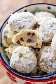 a bowl filled with cookies and powdered sugar