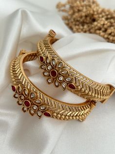 Antique gold finish kada with faux ruby stone finish . Amazing detailing.  openable screw kada ( set of 2) Style tip- Pair it with any beautiful traditional outfits  and flaunt with Unique style of collection from us. Perfect match for Festival and Traditional wear.  Take Care Tips-  Kee away from perfume, Hair spray and. Moisture.  Store in dry place , Ziplock bag or Airtight box.    Clean with dry cloth.  Jewellery is the last thing you should wear and first thing you should remove.  --------- Jewellery South Indian, Cloth Jewellery, Bangles Gold, Bollywood Style, Ziplock Bags, Ruby Stone, Bracelet Jewelry, Bollywood Fashion, Gold Bangles