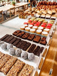 an assortment of desserts and pastries on display