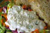 a close up of a plate of food with salad