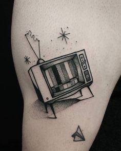 a black and white photo of a tv tattoo