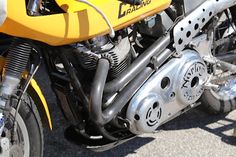 a yellow and black motorcycle parked on the street