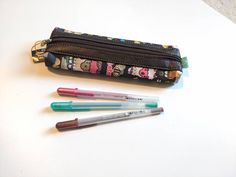 "This cute pencil pouch can hold many small school, personal and artistic items such as pencils, makeup brushes, and paint brushes, just to name a few uses for this accessory. ⭐ Character - Alpaca Valley Size: 8.75\" x 3\" x 1.5\" This listing is for one (1) Pencil Case.   Pictures that show other accessories are meant to give an idea of size and show other items in our store with this same pattern. Please visit our section of FAQ to find more information about your item, our brand and care instructions. - - - - - - - - - - - - - - - - - - - - - - - - - - - - - - - - - - - - Due to the many variations in monitors and browsers, color samples may appear different on different monitors." Brown Rectangular Pencil Case For Daily Use, Brown Pouch Pencil Case For Daily Use, Rectangular Brown Pencil Case For Daily Use, Brown Pouch Pencil Case For Personal Use, Brown Zipper Pouch Pencil Case, Cute Stationery With Pen Slots For Everyday Use, Brown Zipper Pouch Pencil Case For Personal Use, Multicolor Pencil Case With Pen Slots, Pencil-shaped Pencil Case With Pen Holders For Daily Use