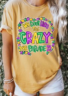 a woman wearing a yellow t - shirt that says we down like the crazy we parade