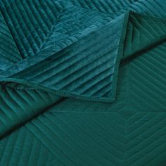 a close up view of a green quilt