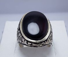 Natural Black Blood Red Yemeni Aqeeq Ring With Beautiful Polished Beautiful Handmade Ring Design 925 Sterling Silver We Happily Provide our Customers '100% Natural Gemstones, 925 Sterling Silver and Magnificent Ring Designs'.We always provide BEST quality material. So Don't miss and Choose the Best. WHY US? * 100% Natural Stones * 925k Sterling Silver * Your satisfaction is very important to us * We are giving you %100 satisfaction guarantee * Returns are accepted under some conditions. * If you Traditional Black Sterling Silver Rings, Traditional Black Ring Jewelry, Traditional Black Rings For Formal Occasions, Traditional Black Rings As Gifts, Traditional Black Ring For Gift, Traditional Black Rings For Gift, Black Onyx Ring Men, Bishop Ring, Aqeeq Ring