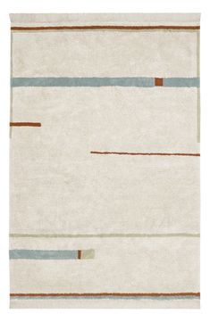 a white rug with brown, blue and green stripes on the bottom half of it