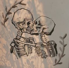 a drawing of two skeletons kissing each other