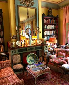 an instagram photo of a living room with furniture and bookshelves on the walls