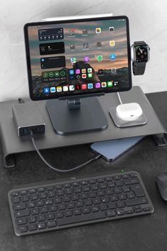 an apple computer and keyboard on a desk