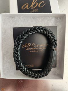 Men's leather bracelet, handmade, stainless steel magnetic clasp. Man's leather bracelet made of black cotton strreads with stainless steel magnetic fastening. Black Leather Braided Bracelet With Stainless Steel Clasp, Black Leather Bracelet With Stainless Steel Clasp As Gift, Gift Black Leather Bracelet With Stainless Steel Clasp, Magnetic Leather Bracelet As Gift, Modern Black Braided Bracelets With Stainless Steel Clasp, Modern Leather Bracelet With Magnetic Clasp As Gift, Modern Magnetic Leather Bracelet As Gift, Modern Black Leather Bracelet For Everyday Use, Modern Black Leather Bracelet For Everyday