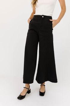 a pair of black wide-leg pants that are sooo good, you’ll never want to take them off. the high-rise + fitted waistline gives it “business casual” charisma, while the flowy loose legs keep things real + relaxed. full of versatility, you can dress them up or down for any occasion. black // wide leg, high waisted, one button zip fly, belt loops, pockets paired with our matilda mesh top + lover denim vest model is 5'8" + wearing a small measurements are approximate + taken while laying flat small : Elegant Wide Leg Flare Jeans For Work, Chic High Rise Wide Leg Pants With Relaxed Fit, Trendy High Rise Wide Leg Workwear Pants, Chic Wide Leg Flare Jeans For Work, Black High Waist Flare Jeans For Work, Chic Spring Wide Leg Pants For Casual Wear, High Waist Flare Jeans For Work, Versatile Wide Leg Pants For Elevated Casual Fall Wear, High Waist Wide Leg Pants For Date Night