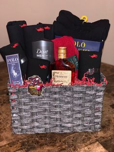 a basket filled with liquor and other items