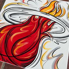 a painting of a red bird with yellow and white flames on it's wings