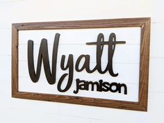 a wooden sign that says wyatt and jamson on it