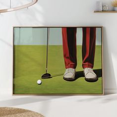 a painting of a man's legs and feet with a golf ball on the green