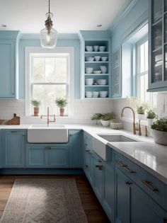 a kitchen with blue cabinets and white counter tops