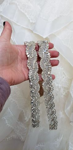 These Attachable Wedding Dress Straps are a great addition to any dress. They measure 18 to 25 inches long and 1 inch wide. These are made with pear shaped diamante rhinestones in silver settings, silver seed beads and silver chain rhinestones. The decorated part is lined with oatmeal felt which gives the straps support and comfort! Like our Facebook page and receive a 10% discount when you message me before checkout! Everything made by handmade MKE is one of a kind and unique, however, if you w Silver Fitted Bridal Accessories, Glamorous Embellished Bridal Belt For Wedding, Fitted Rhinestone Bridal Belt For Wedding, Silver Bedazzled Bridal Belt For Wedding, Embellished Fitted Bridal Belt, Fitted Silver Bridal Belt For Bride, Silver Fitted Bridal Belt, Embellished Silver Bridal Belt, Silver Embellished Bridal Belt