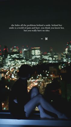 a woman sitting on top of a window sill in front of a cityscape