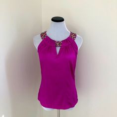 Beautiful, Nwt! Fuchsia Colored Sleeveless Cache’ Top Silk And Spandex Blend With Beading Around The Neckline And Three Hook And Eye Enclosures At The Back Of The Neck. Zips At The Side For A Fitted Silhouette. Size Small Approximately 24 Inches Long Armpit To Armpit Approximately 16.5 Inches. Chic Embellished Stretch Tank Top, Purple Embellished Sleeveless Top, Elegant Purple Tank Top, Blue Ruffle Top, White Halter Top, Black Halter Top, Half Sleeve Shirts, Black Sleeveless Top, Silk Tunic