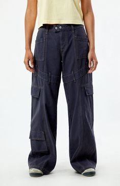 Step into street-style confidence with the Navy Low Rise Baggy Cargo Pants from PacSun. These pants feature a low-rise waist, contrast stitching throughout for added flair, belt loop details around the thigh, and cargo and patch pockets for utility. With their relaxed baggy fit, they offer both comfort and a bold, streetwear-inspired look for any casual outing.Model is wearing a size 26Model measurements: 5’7” height, 32” bust, 24” waist, 35” hip PacSun Womens Navy Low Rise Baggy Cargo Pants - Blue size 26 Utility Pants Outfit Street Style, Navy Cargo Pants Outfit, Utility Pants Women, Low Rise Baggy Cargo Pants, Utility Pants Outfit, Cargo Pants Aesthetic, Cargo Pants Navy, Baggy Pants Outfit, Navy Cargo Pants