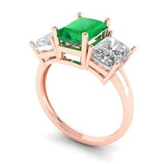 three stone emerald and diamond ring in rose gold