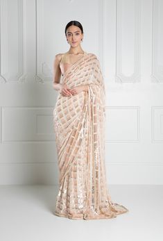 A peach-hued saree with sequin square embroidery Matched with a two-tone peach silk blouse. Comes with a peach in-skirt. This is a Three piece look. Please note: The colour may slightly vary. To custo Trending Saree, Georgette Saree With Blouse, Saree Party Wear, Multicolor Sequins, Designer Silk Sarees, Work Pattern, Traditional Saree, Party Wear Saree