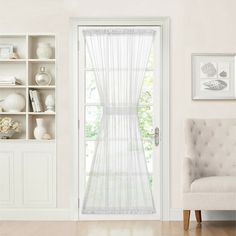 a living room with white walls and furniture