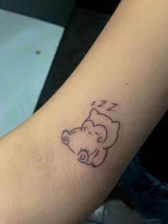 a small elephant tattoo on the arm