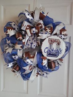 a football wreath is hanging on the front door