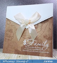 a card with a white ribbon on it