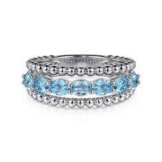 This sterling silver ring features a Swiss blue topaz gemstone with a total carat weight of 1.34. Part of the Gabriel & Co collection. Blue Topaz Gemstone, Natural Diamond Engagement Ring, Silver Anklets, Swiss Blue Topaz, Stackable Ring, Custom Jewelry Design, Silver Pendants, Topaz Gemstone, Diamond Bracelets