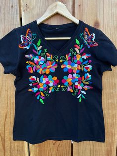 Cute ! Hand embroidered t-shirts hand made ! Each shirt is one if a kind ! Unique embroidery! Very comfortable and fresh t- shirts ! Fabric : cotton. Care: hand wash/ hang to dry/ low iron/no bleach. Size : MEDIUM: (6US) Black Embroidered T-shirt For Summer, Short Sleeve Shirt With Multicolor Floral Embroidery, Summer Short Sleeve Shirt With Embroidered Text, Spring T-shirt With Multicolor Embroidered Text, Multicolor Embroidered Text T-shirt For Spring, Summer T-shirt With Multicolor Embroidery, Embroidered Black T-shirt For Spring, Black Cotton Tops With Machine Embroidery, Black Embroidered Summer T-shirt