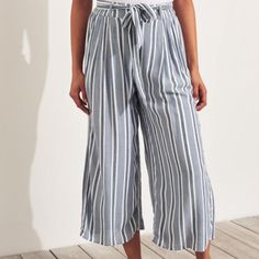 Hollister Ultra High Rise Culottes Womens S Chambray Blue Nwt Discontinued Viscose Machine Wash Crop Lightweight Non Stretch Woven Construction Back Elastic Waistband Belt Loops Tie Belt Pull On Lined Side Pockets Also Shown In Dark Navy Stripe Striped Wide-leg Summer Pants, Striped Long Pants For Summer, Summer Wide-leg Bottoms For Brunch, Blue Pants For Summer Vacation, Striped Trousers For Summer, Striped Summer Trousers, Blue Summer Pants For Vacation, High Waist Summer Pants For Brunch, Summer Vacation Blue Pants