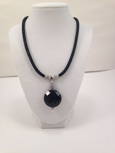 Pendant Necklace, Beautiful pendant and leather necklace, black faceted pendant, special occasion necklace, sophisticated necklace This necklace is sophisticated.  The black faceted pendant is 1-1/4 round.  The complete pendant and bail is 2-1/2" long.  The pendant hangs from an 18" black leather cord with a 1-1/2" extension chain.   A 3mm black bead hangs from the extension.  The silver is plated All jewelry is shipped in gift boxes. Heart Shaped Earrings, Black Pendant, Black Necklace, Necklace Black, Black Earrings, Leather Necklace, Necklace Silver, Black Beads, Leather Cord