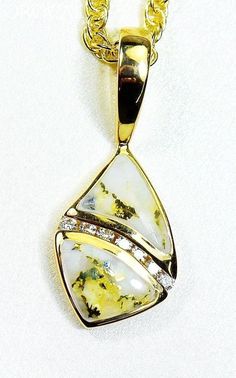 Gold Quartz/Diamonds Pendant "Orocal" PN1071DQ Genuine Hand Crafted Jewelry - One of a Kind - 14k Casting-Approx. weight = 2.5G" If this is not in Stock our Jeweler will make it in 4-6 weeks"Specs and Dimensions: Length/WidthQuartz Stone Size 5x8 mmBail Size 8x3 mmDiamonds - .10ct Total- R stands for Ring, L for Ladies, M Stands for Men, Q stands for the Quartz / E Stands for Earrings and P Stands for PendantWith This Stunning Gold Quartz Pendant you will receive a certificate of authenticity ea Fine Jewelry In Yellow Gold With Natural Inclusions, Unique Pear-shaped Gold Jewelry, Yellow Gold Jewelry With Natural Inclusions For Anniversary, Klondike Gold Rush, Natural Gold Nugget, Gold Nugget, Gold Alloys, Vermeil Jewelry, Gold Flakes