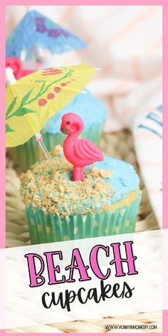 cupcakes with blue frosting and pink flamingo decoration on top are sitting in a wicker basket