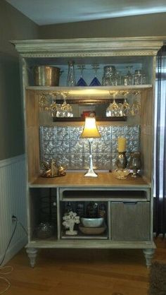 a room with a lamp and shelves on the wall