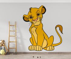 the lion cub wall decal is shown in this children's room