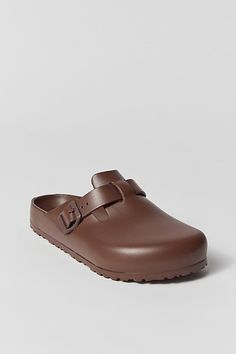 The classic Boston clog by Birkenstock gets a lightweight EVA update. Features a closed toe clog silhouette with an adjustable strap & buckle. Finished with textured tread at the outsole. Features Lightweight EVA clogs from Birkenstock Updated Boston silhouette Textured outsole Content + Care EVA Spot clean Imported | Birkenstock Boston EVA Clog in Roast, Men's at Urban Outfitters Classic Outdoor Clogs With Textured Footbed, Brown Outdoor Clogs With Buckle Closure, Brown Clogs With Buckle Closure For Outdoor, Clog Style, Clogs Style, Boston Clog, Birkenstock Boston, Birkenstock Boston Clog, Birkenstock