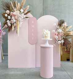 pink and gold wedding decor with flowers on display