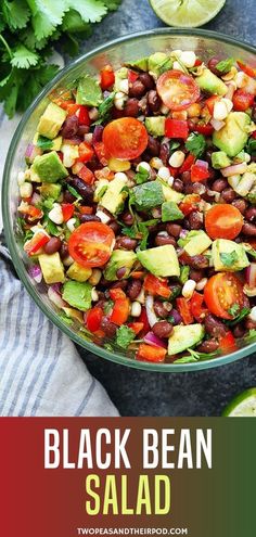 black bean salad with tomatoes, avocado and cilantro in a glass bowl