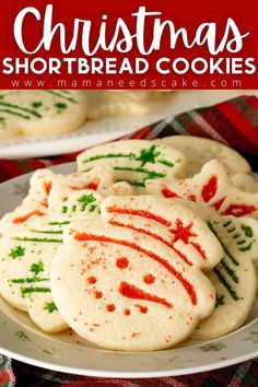 christmas shortbread cookies on a white plate with red and green sprinkles