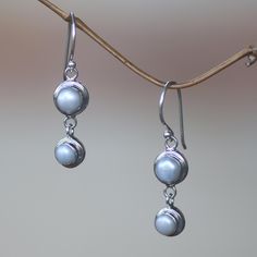 Silver moonlight radiates from luminous pearls, set in argent circles, they become dancing dangle earrings by Bali's Nyoman Rena. Pearls represent June´s birthstones. Sterling silver and freshwater cultured pearls Hook earrings Handmade in & fairly traded from Indonesia Silver Pearl Drop Earrings, Paw Print Jewelry, Buy Pearls, Ribbon Jewelry, Pearl Dangle Earrings, Printed Jewelry, Sterling Silver Dangle Earrings, Pearl Earrings Dangle, Freshwater Cultured Pearls