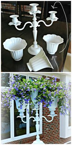 some white vases with purple flowers in them and one is hanging from the ceiling