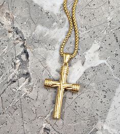 "《《  SPIRITUAL COLLECTION  》》 THE DETAILS The \"GOLD TWISTED CROSS\" Necklace is designed with an exquisitely detailed Gold Stainless Steel Twisted Cross Pendant, hung from a Gold Stainless Steel Box Chain available in your choice of length! 💠🔶️💠View entire SPIRITUAL COLLECTION here: https://www.etsy.com/shop/mrmackjewelry/?section_id=27046119 MATERIALS * 1 3/4\" × 1 1/4\" Gold Stainless Steel Twisted Cross Pendant  * 3mm Gold Stainless Steel Box Chain  * Gold Stainless Steel Lobster Clasp ⤵️ Gold Adjustable Chain Jewelry For Father's Day, Gold Cross Necklace With Rope Chain As A Gift, Father's Day Gold Jewelry With Adjustable Chain, Gold Cross Necklace For Father's Day, Cheap Gold Men's Cross Necklace, Gold Cross Pendant For Men, Gold Crucifix Cross Necklace In Stainless Steel, Mens Cross Pendant Gold, Gold Cross Necklace Mens Jewelry1000.com