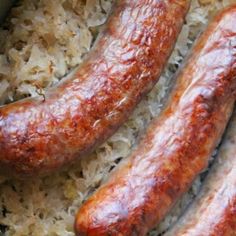 two sausages are sitting on top of rice