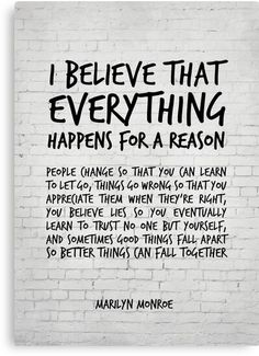 marilyn monroe quote on white brick wall with black lettering that says i believe that everything happens for a reason