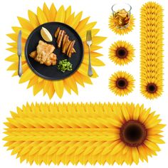 sunflowers and plates with food on them are arranged in the shape of an arrow