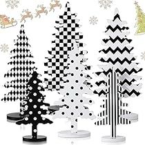 christmas trees are lined up in black and white